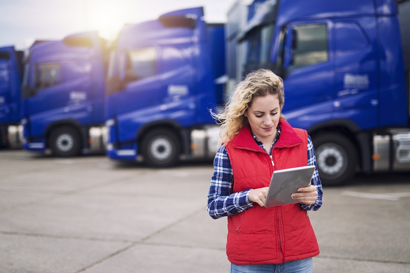 Truck driver holding tablet